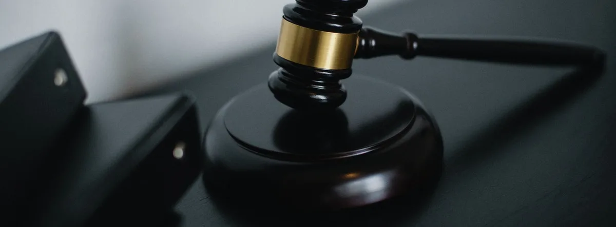 Lifetime Withdrawal from Industry A judge's gavel striking to make a decision, symbolizing legal authority, justice, and the finalization of important matters.