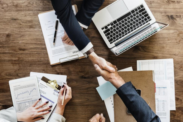 Marketing Your Home Realtor a client agreed on deal and shaking hands