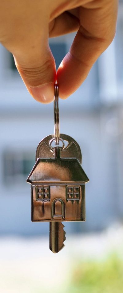 Keychain with House and Key – Symbolizing Your New Home in Calgary Keychain featuring a house and key, symbolizing the excitement of owning a new home in Calgary, perfect for real estate promotions.